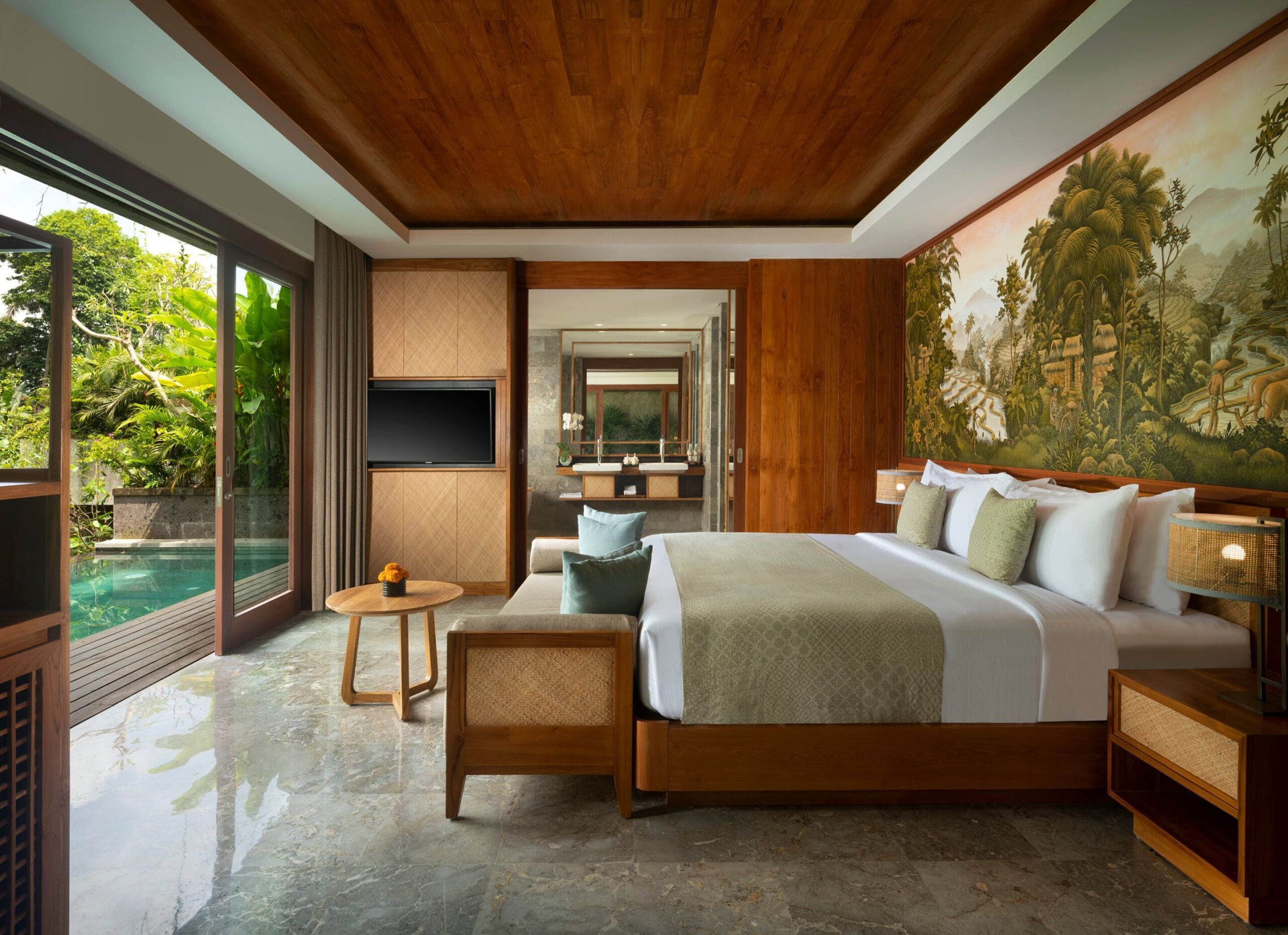 Villa bedroom looking out to the private pool at Adiwana Suweta, Ubud