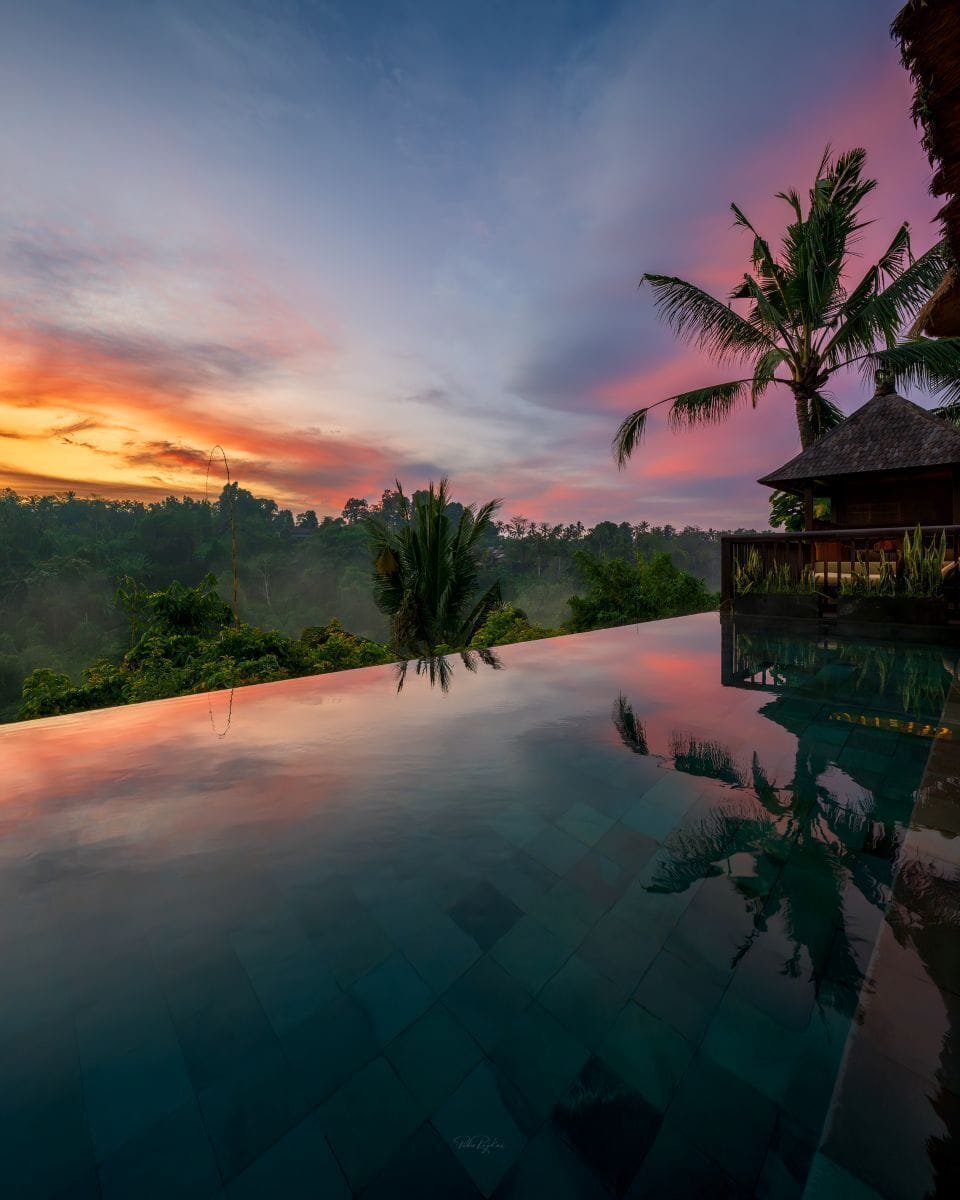 The twin-tier infinity pool suspended over the Ayung gorge at sunset, Hanging Gardens of Bali