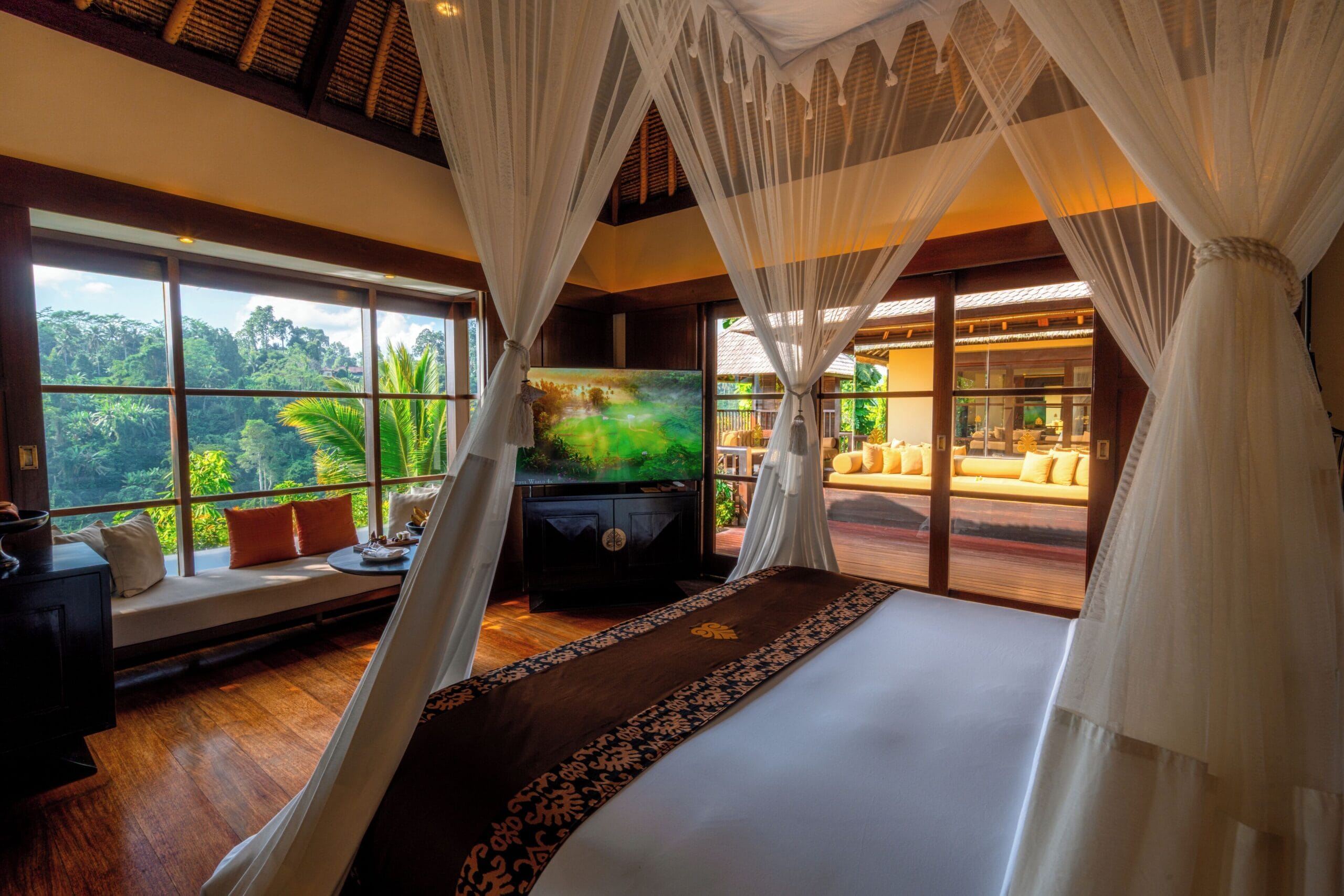 Villa bedroom opening onto the jungle canopy at Hanging Gardens of Bali
