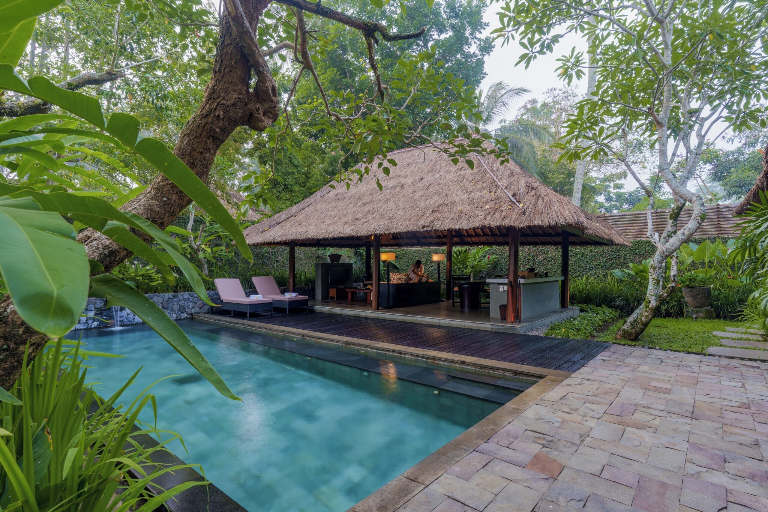 Private pool inside a walled thatched villa at Kayumanis Ubud, Bali