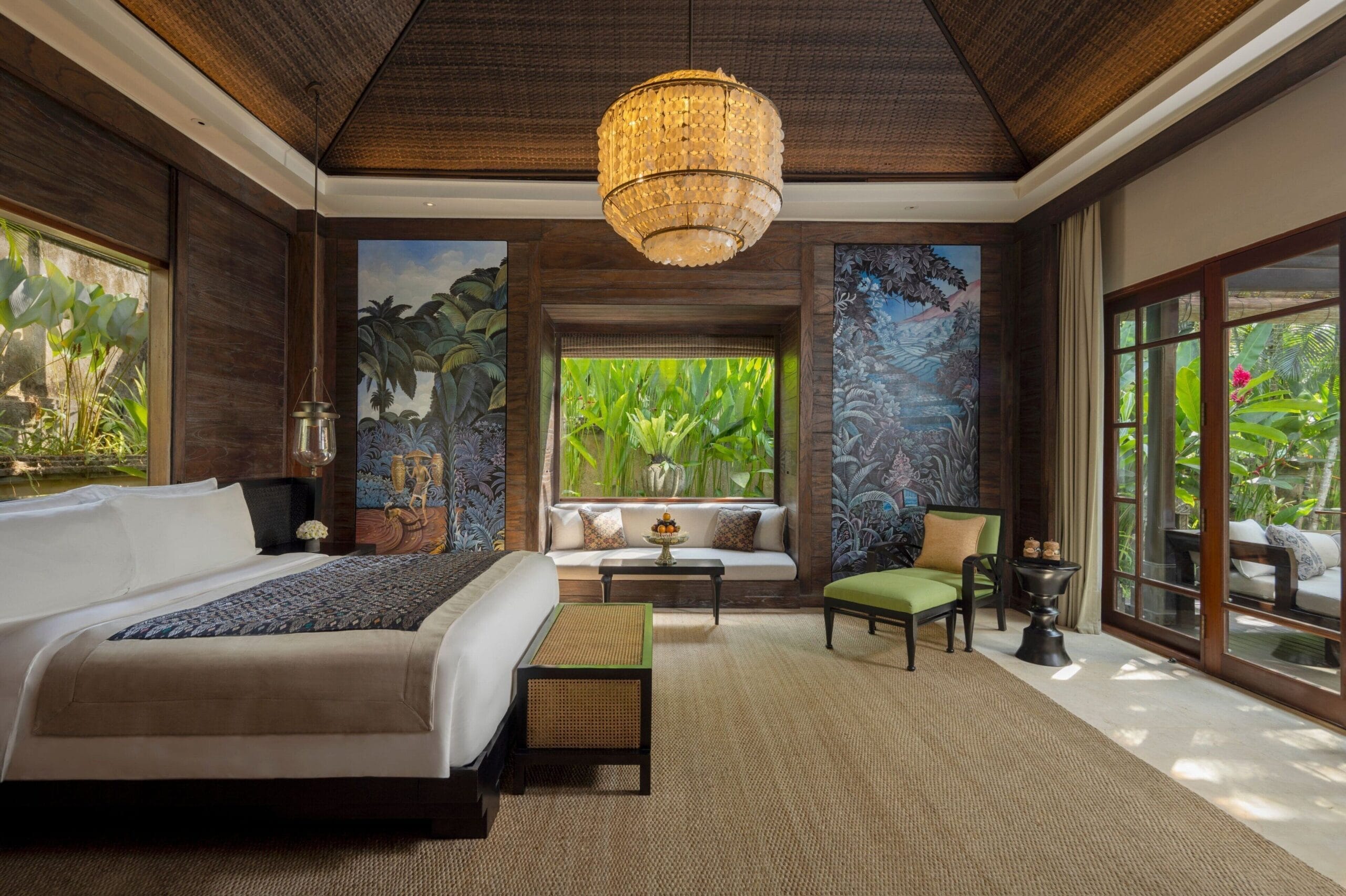 High-ceilinged villa bedroom with botanical panels at Mandapa, a Ritz-Carlton Reserve, Ubud